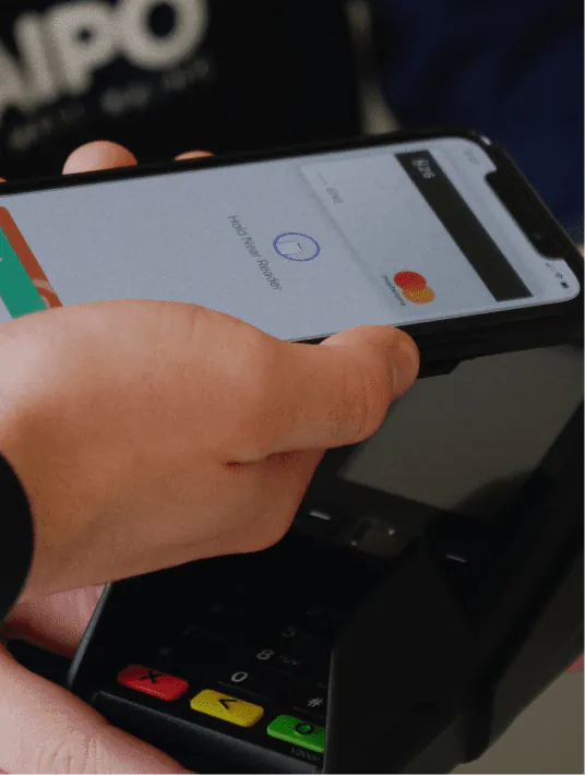 User interacting with a secure fintech mobile app featuring biometric authentication, financial dashboards, and intuitive UX design elements.