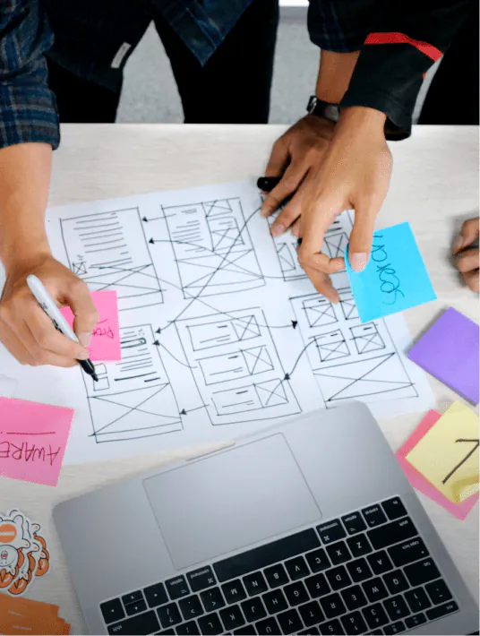 Team collaborating on Lean UX product development using wireframes, user testing insights, and agile design workflows.