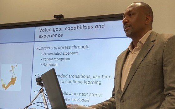 Dale giving a presentation on navigating career transitions