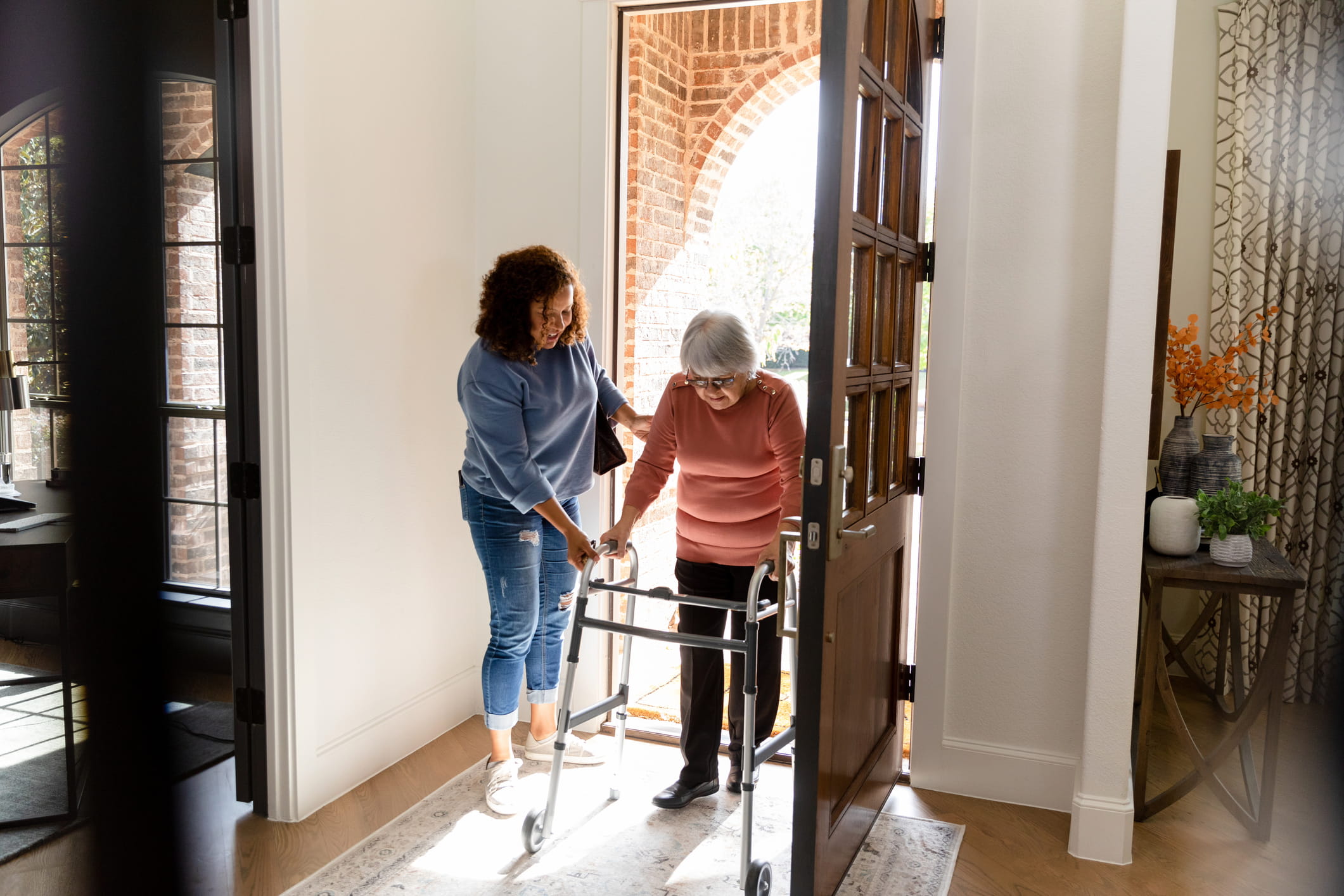 Caregiver providing home care during the daytime for a senior.