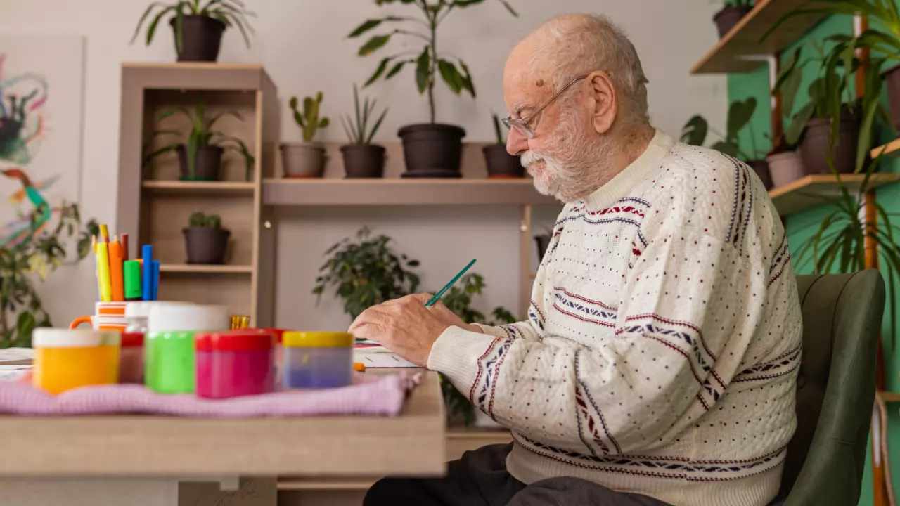 Elderly man staying comfortable at home while getting cared for.