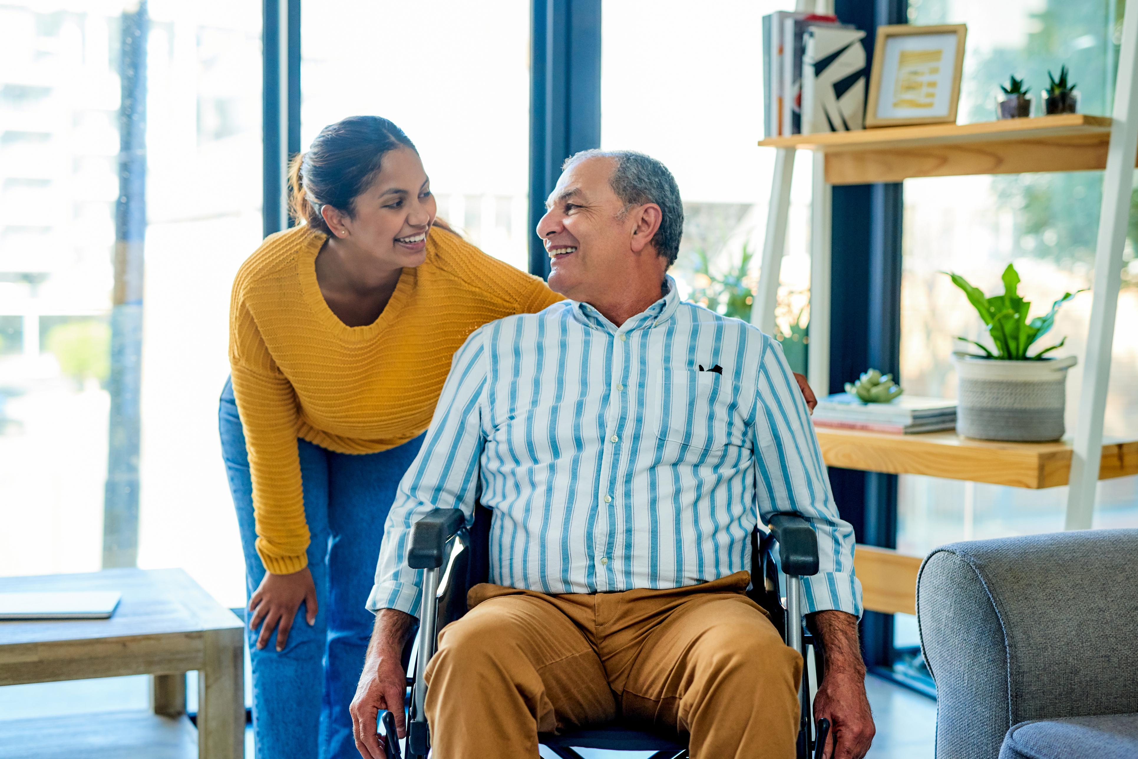 Arabic-speaking caregiver helping Arabic-speaking senior.