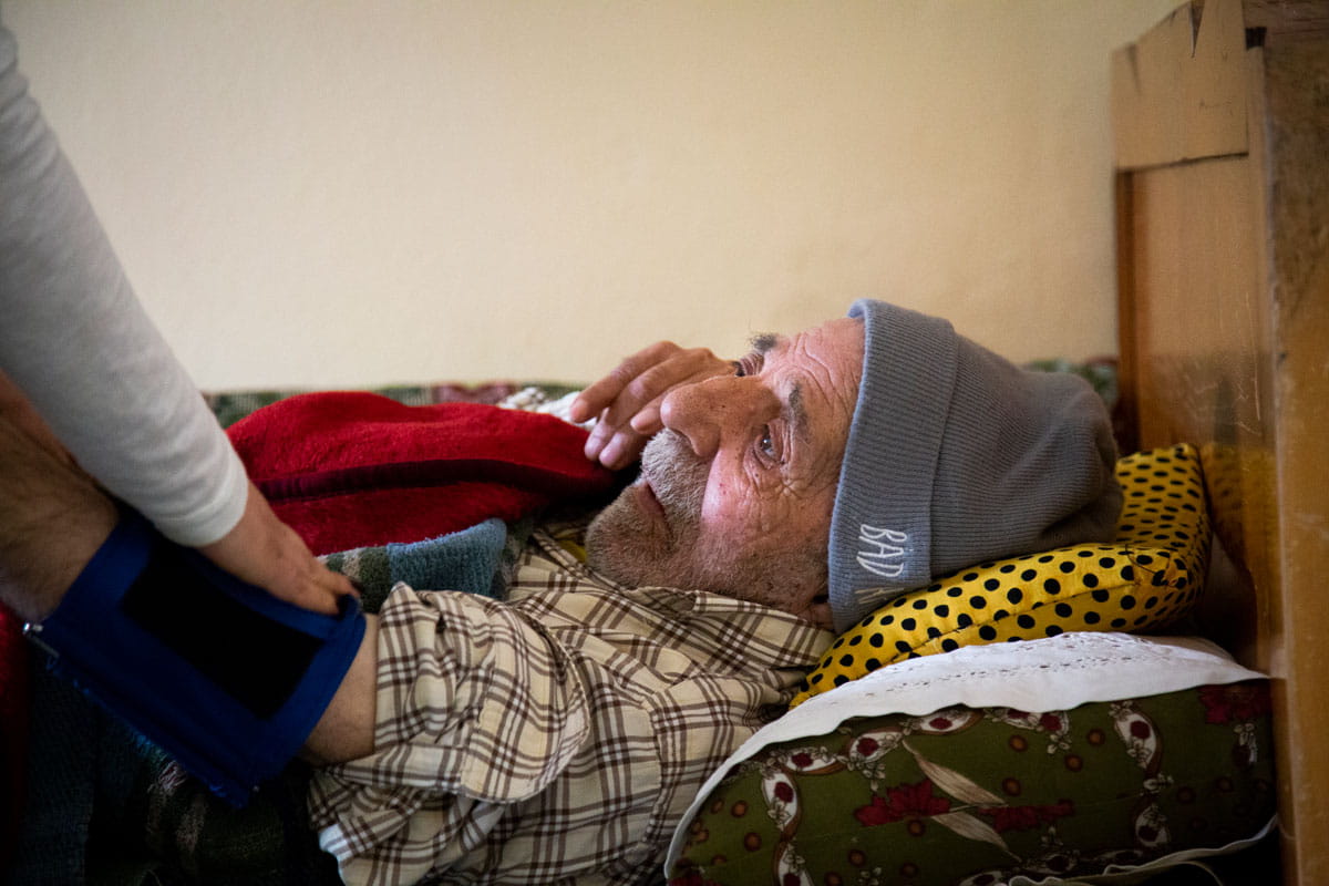 Middle eastern man receiving care from a caregiver.