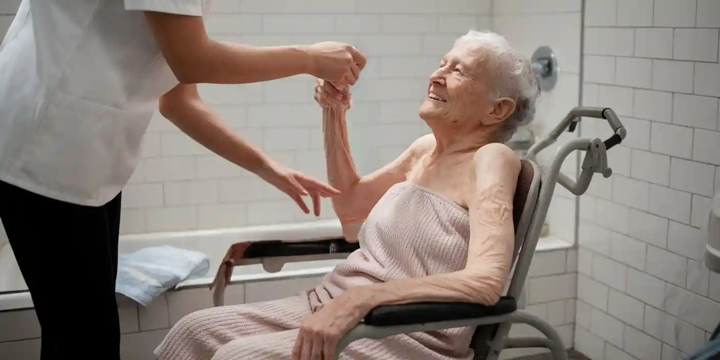 Senior getting ready for a caregiver to give her a bath.