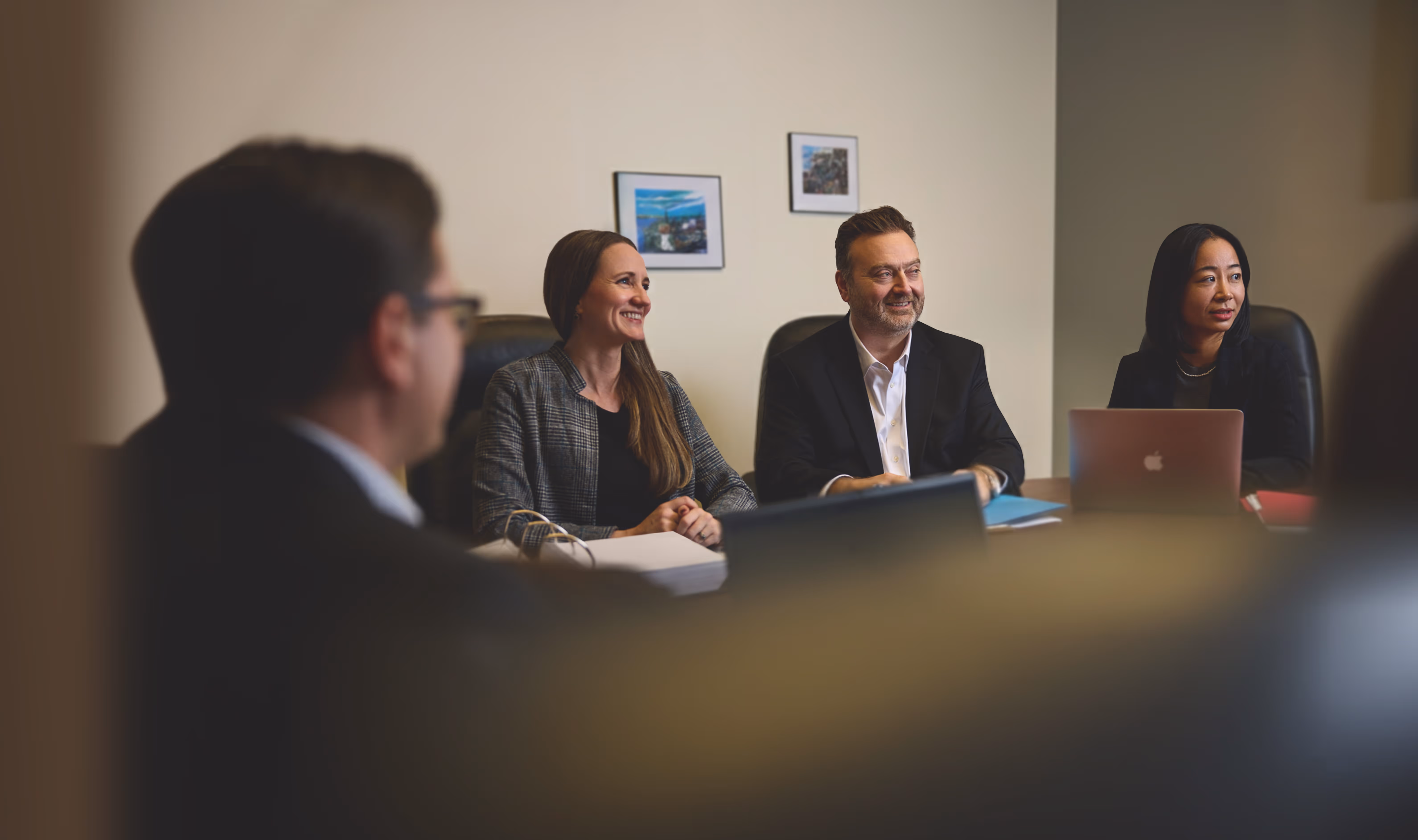 Professional team of CLG Injury Law lawyers meeting in an office conference room serving clients across New Brunswick, Nova Scotia and Prince Edward Island.