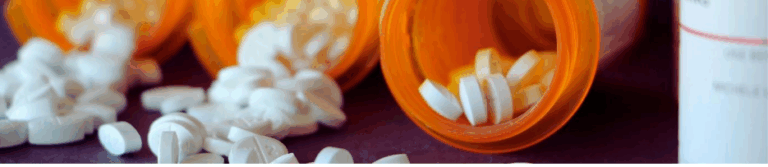 Prescription medication bottles representing treatment for post traumatic stress and anxiety after motor vehicle collision