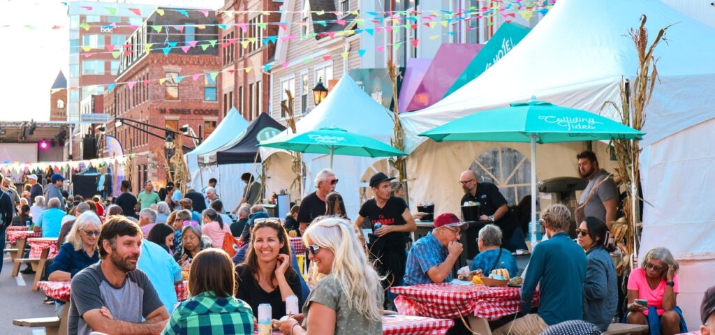 Crowd enjoying outdoor food and music festival in downtown Atlantic Canada