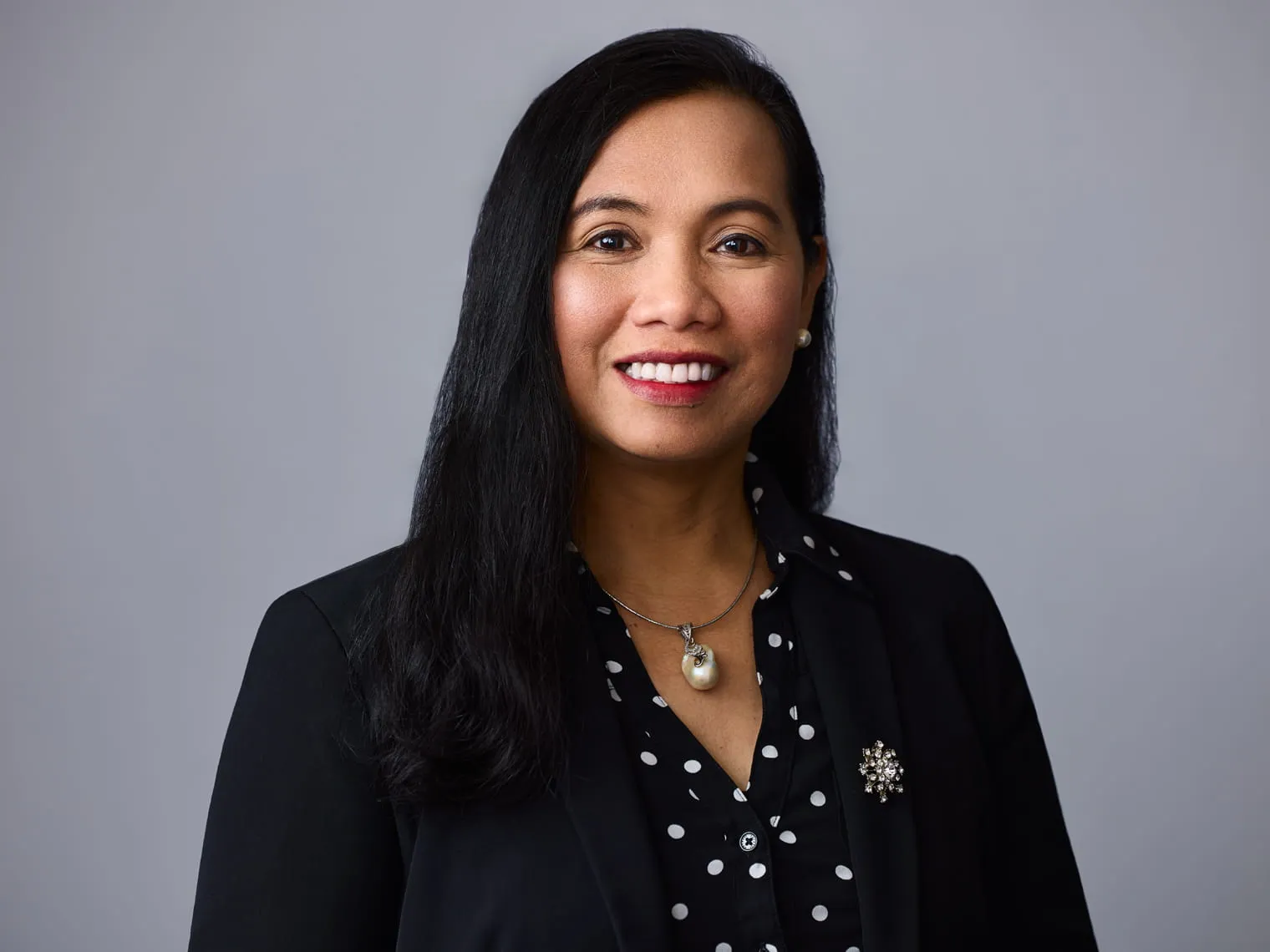 Professional headshot of Divina Flores, Case Management Coordinator at CLG Injury Law.