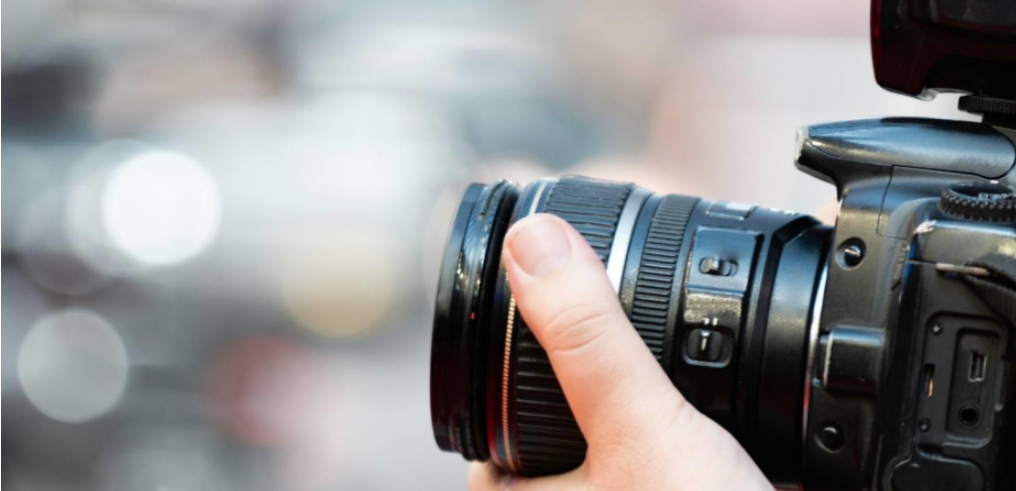 Close up of camera lens symbolizing insurance surveillance in personal injury claims and litigation