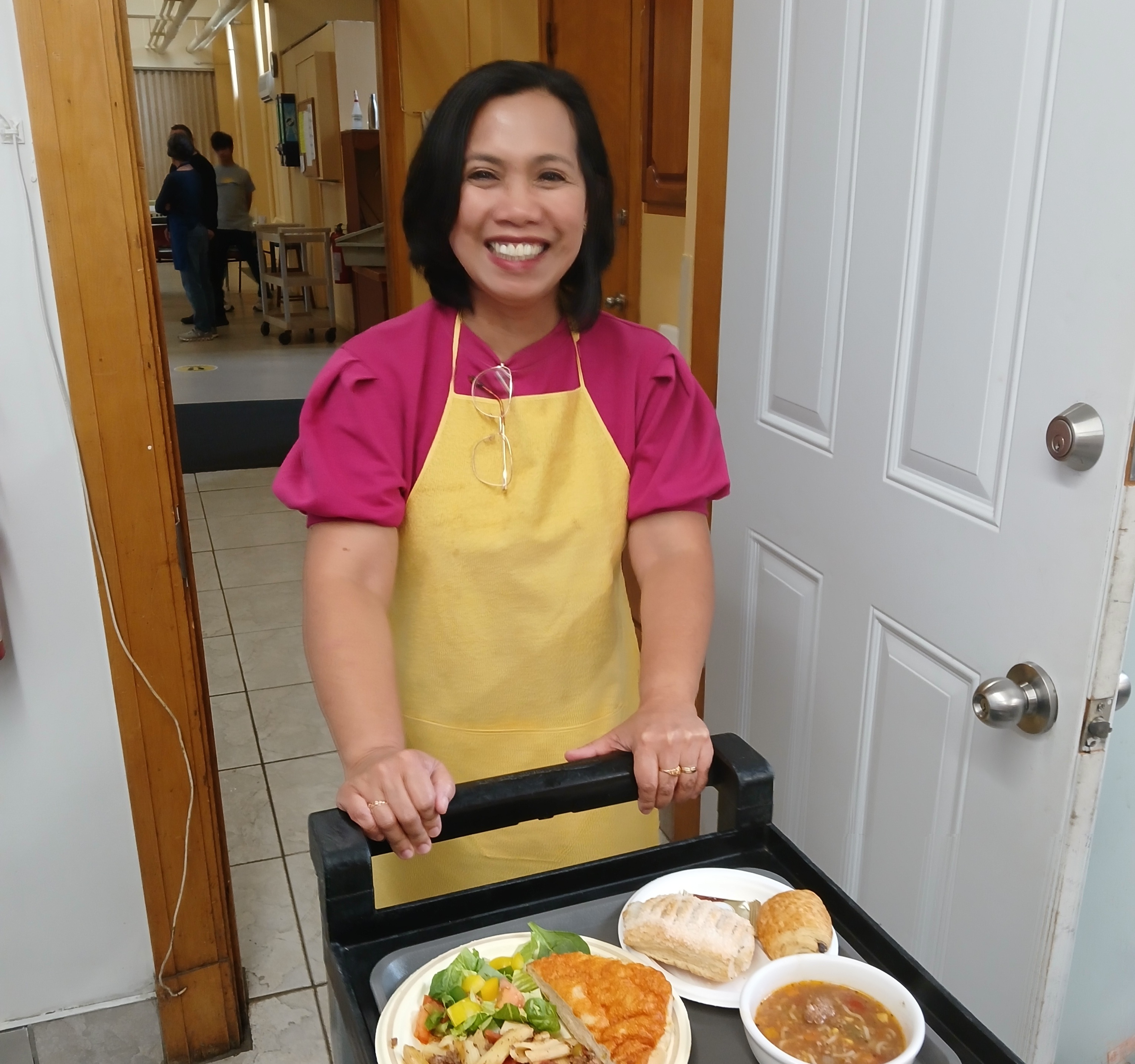 CLG team member volunteering in a community kitchen during the firm’s monthly staff volunteering day initiative.