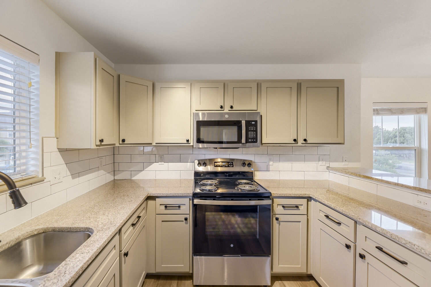 Kitchen with light cabinets, and stainless steel appliances