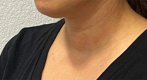 A close up of a woman wearing a black shirt