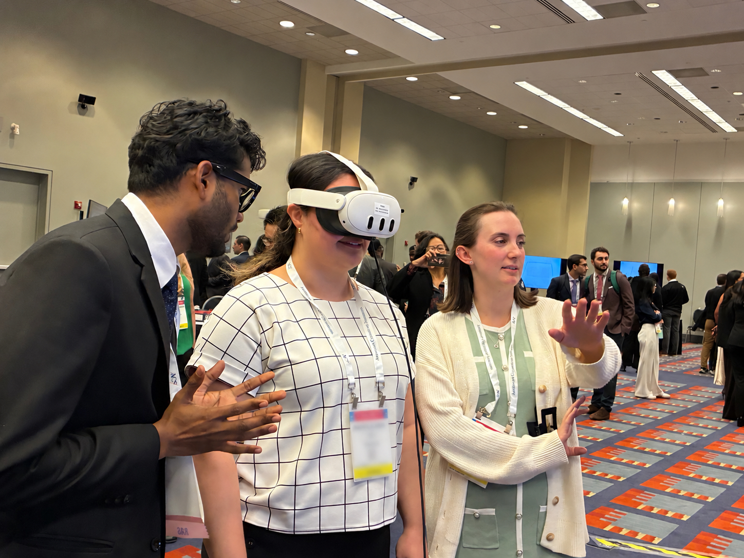 An attendee using a VR headset during a hands-on demonstration at ACS Clinical Congress 2026