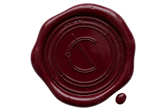Dark red wax seal with an embossed circular monogram featuring the letter C crossed by a diagonal line.
