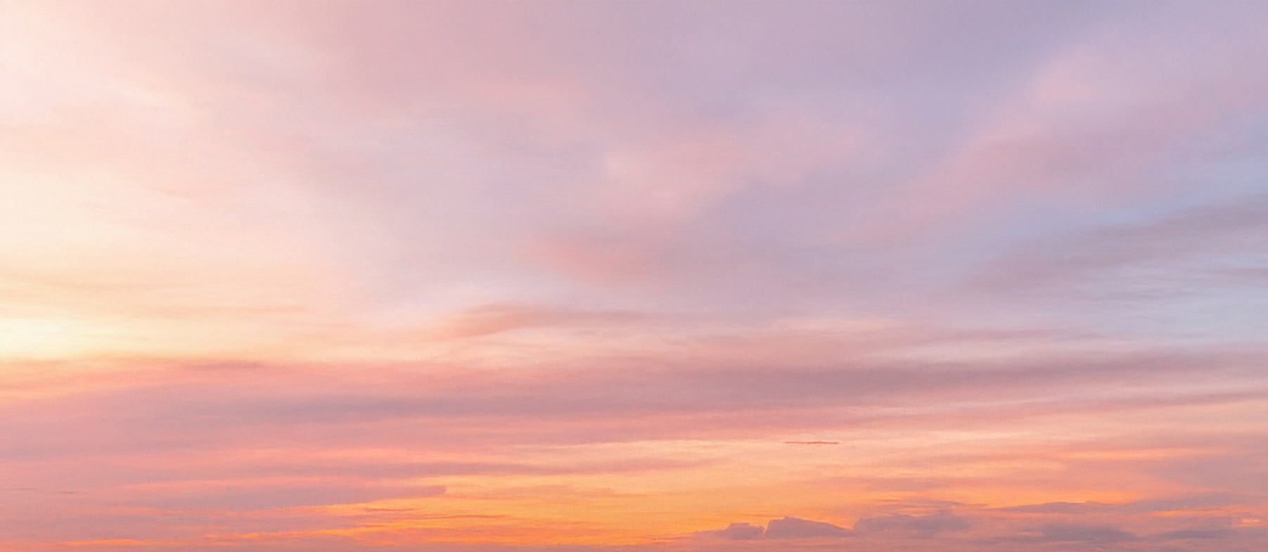 Pastel-colored sky during sunset with soft hues of pink, purple, and orange.