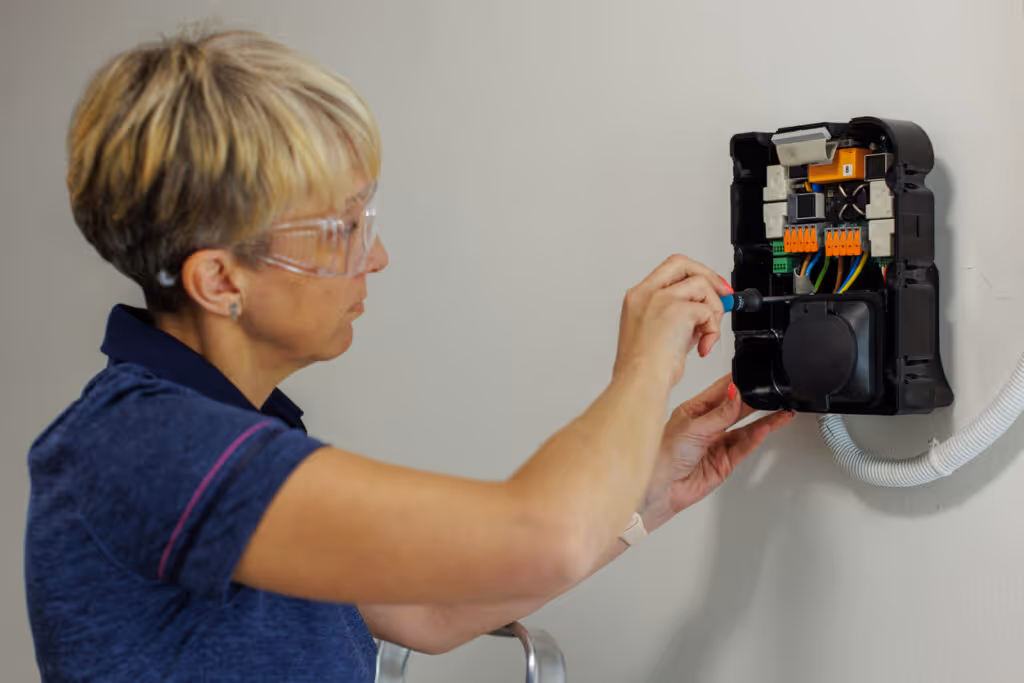 Certified Female Electrician Installing Home EV Charger