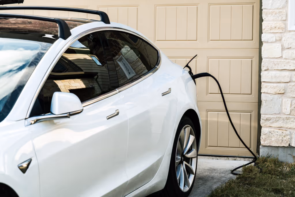 White Tesla Model Charging at Home