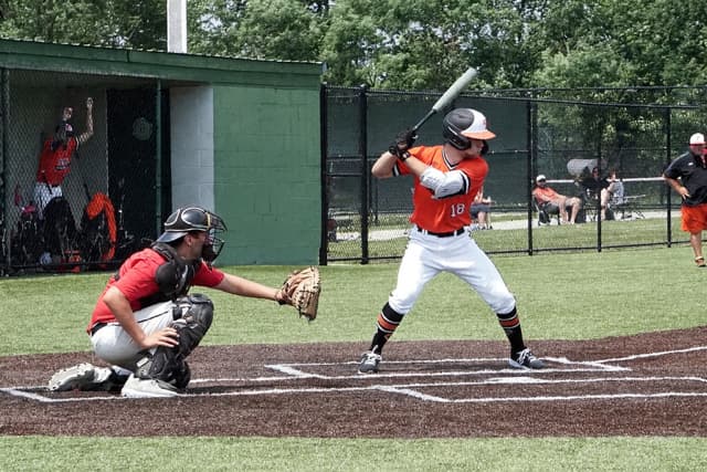 Golfer taking a shot, viewed from behind