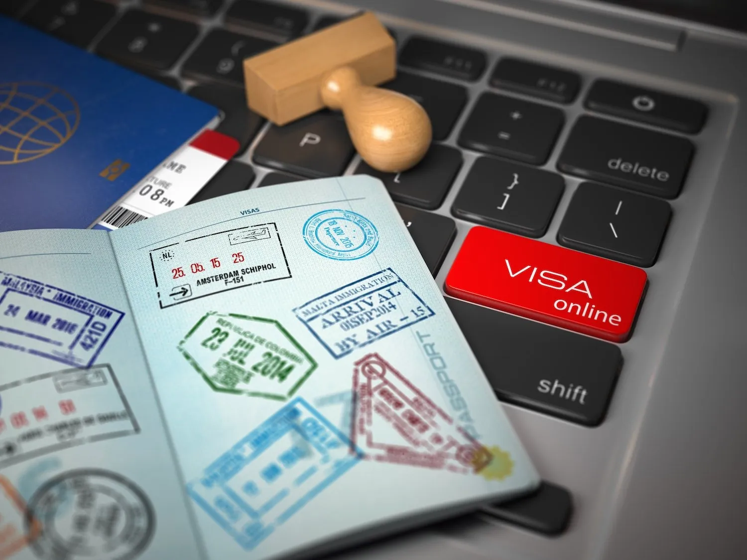 Visa online application concept. Open passport with visa stamps with airline boarding pass tickets and stamper on the computer keyboard, 3D illustration USCIS artist visa impulse magazine.