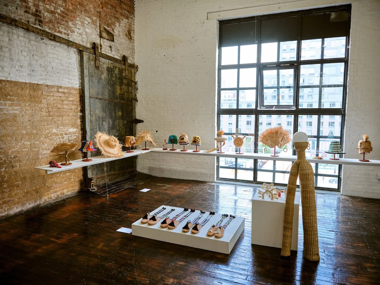 Raffia hats and shoes on display at SUDESTADA, an Argentine fashion consultancy collaborating with Latin American artists, Gimena Garmendia.