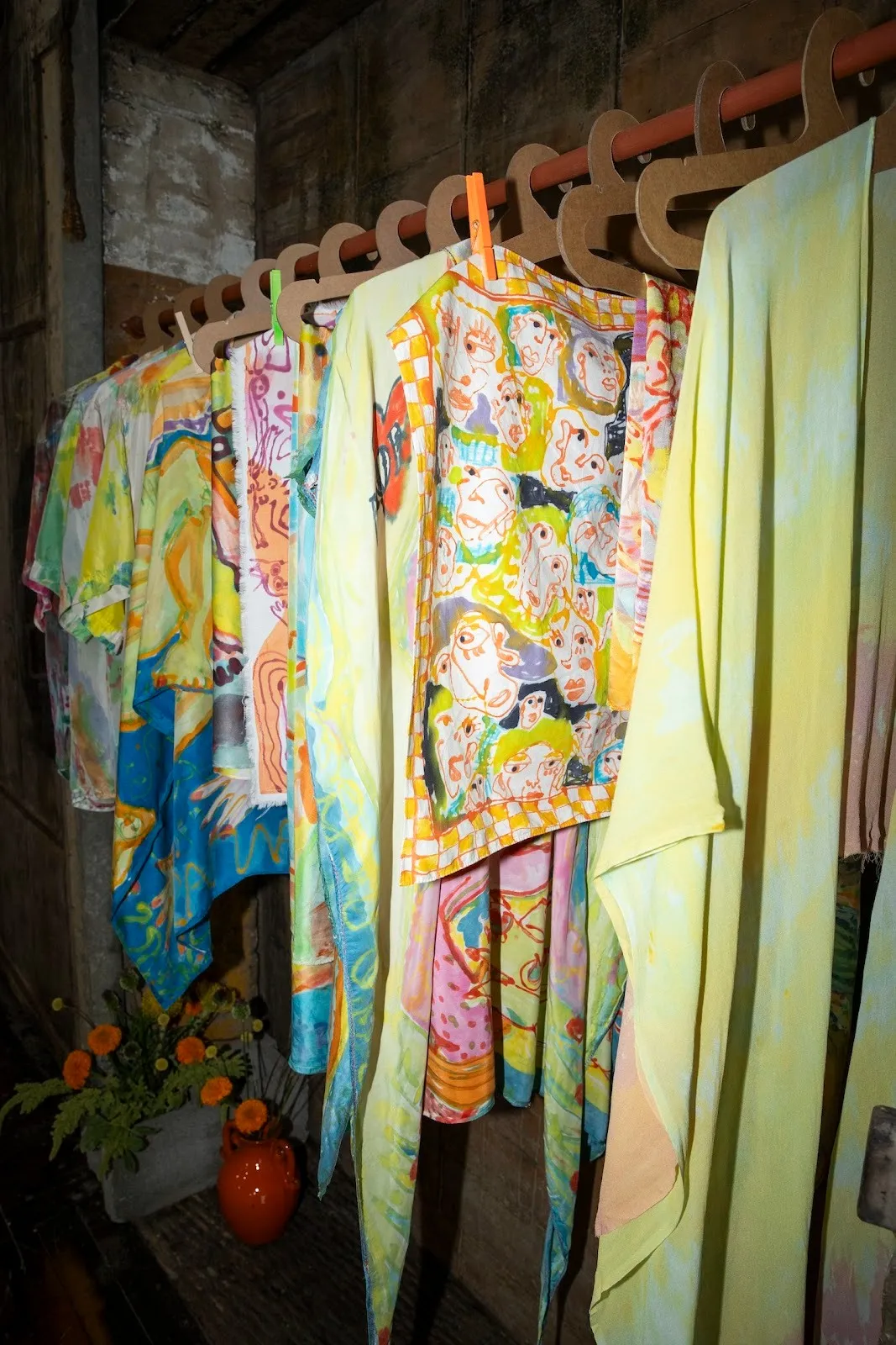 Colorful capes and scarves on a clothing rack, why are we so afraid, Florencia Montefalcone, SUDESTADA, Argentine fashion consultancy collaborating with artists, Gimena Garmendia.