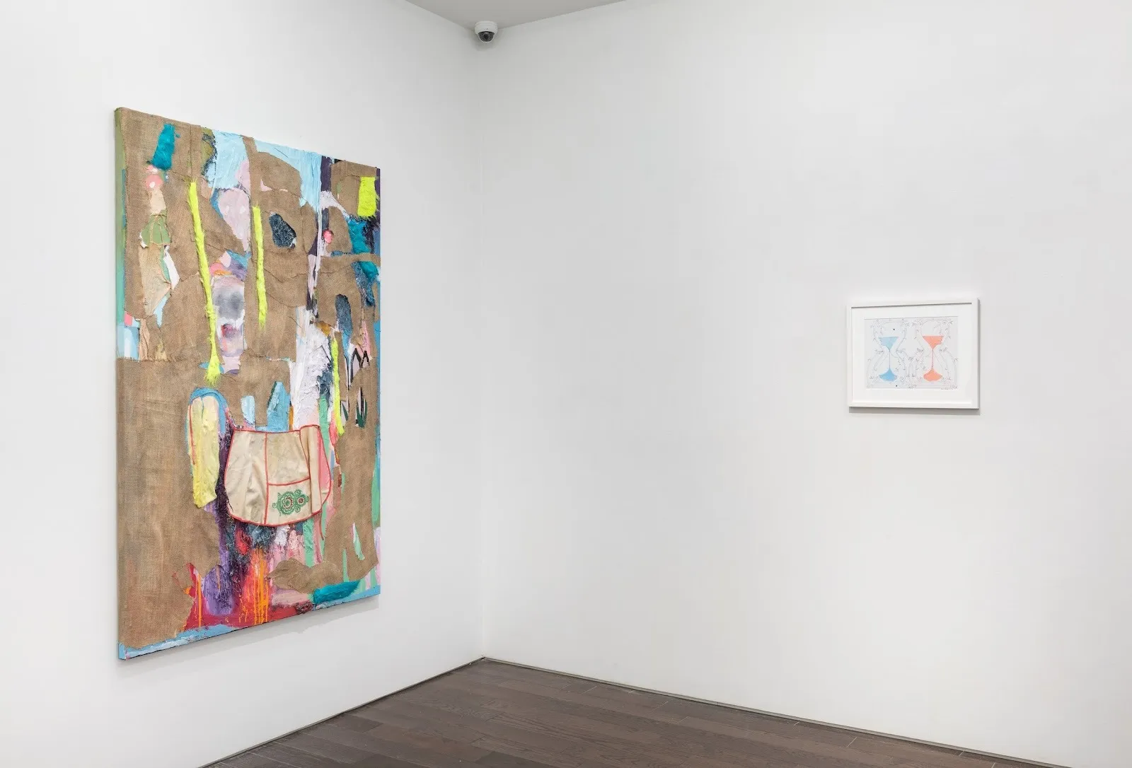 One big collage by Katya Grokhovsky hanging next to blue and pink drawing of two hourglasses by Bianca Abdi-Boragi, Clairvoyant gallery exhibition.