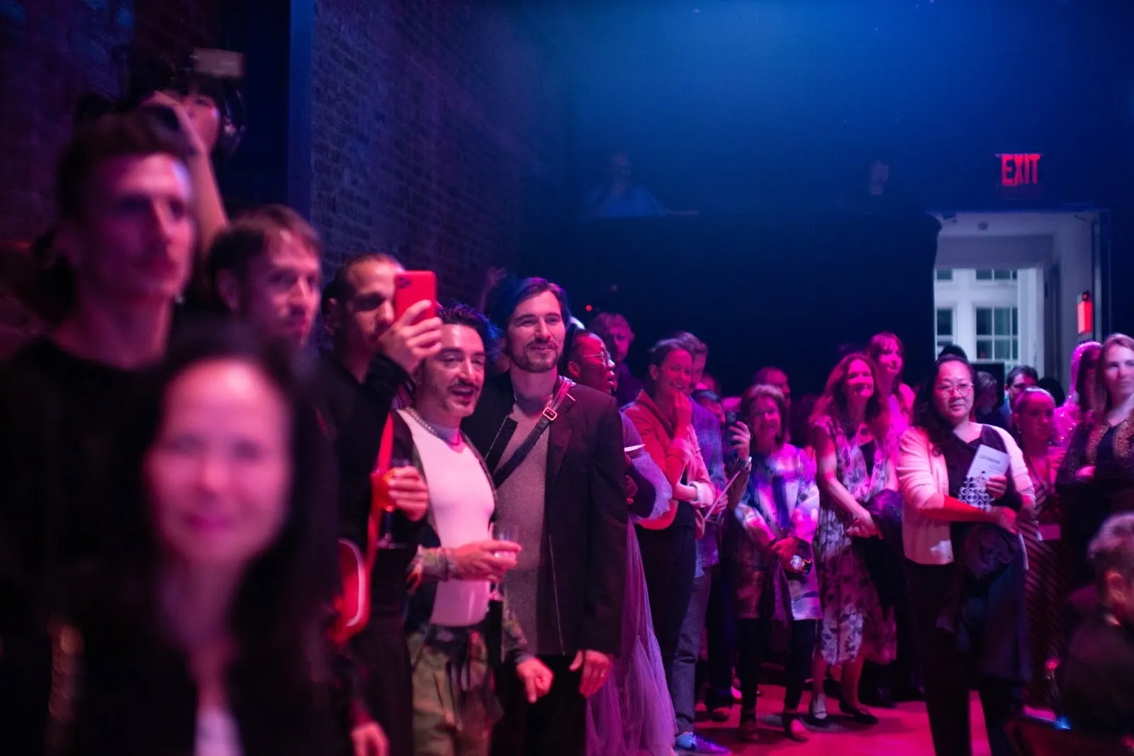 La MaMa theater's 63rd benefit party, dim room full of partygoers.