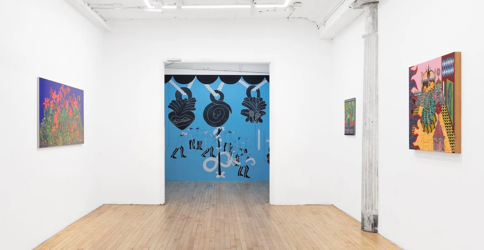 Installation view of site-specific mural for Tell Me How It Ends by Miguel Martinez, room with blue walls and traditional Mexican artistic imagery, colorful paintings and a separate white walled Gallery room.