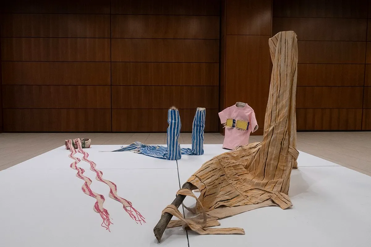 Zoe Ann Cardinal Cire, Over(us)alls , installation and pop sculpture of t-shirts, pants, scarf, and oversized overalls at art toronto's two seven two booth.