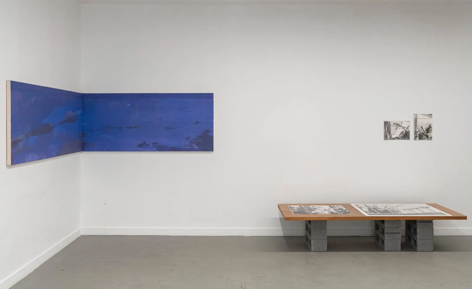 Installation view of painting exhibition by latin american emerging artists that explore passage of time and landscape at NADA gallery, new york, titled 05:59 by Concordia Studio.
