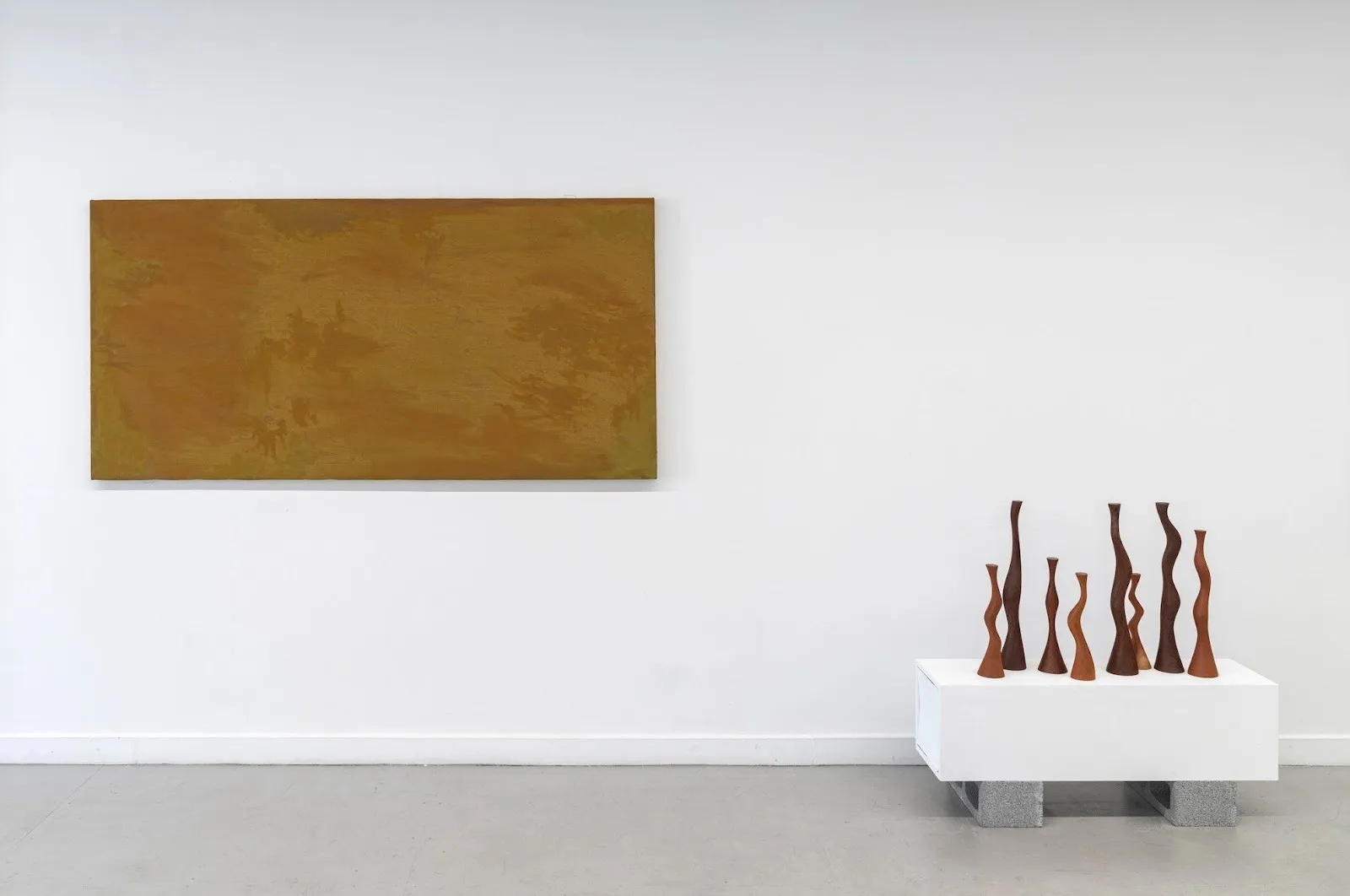 Installation view of painting exhibition by latin american emerging artists that explore passage of time and landscape at NADA gallery, new york, titled 05:59 by Concordia Studio.