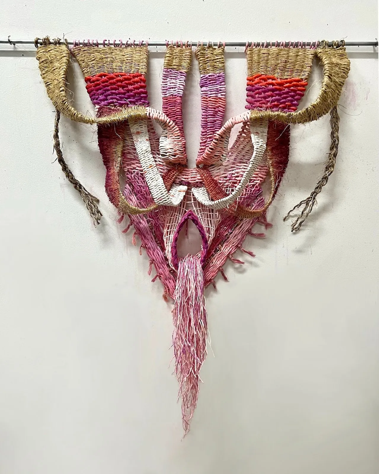 Pink fiber and paper sculpture by Ukrainian artist kathie halfin who explores plant motifs, despite the floom hand-dyed and hand-spun paper.