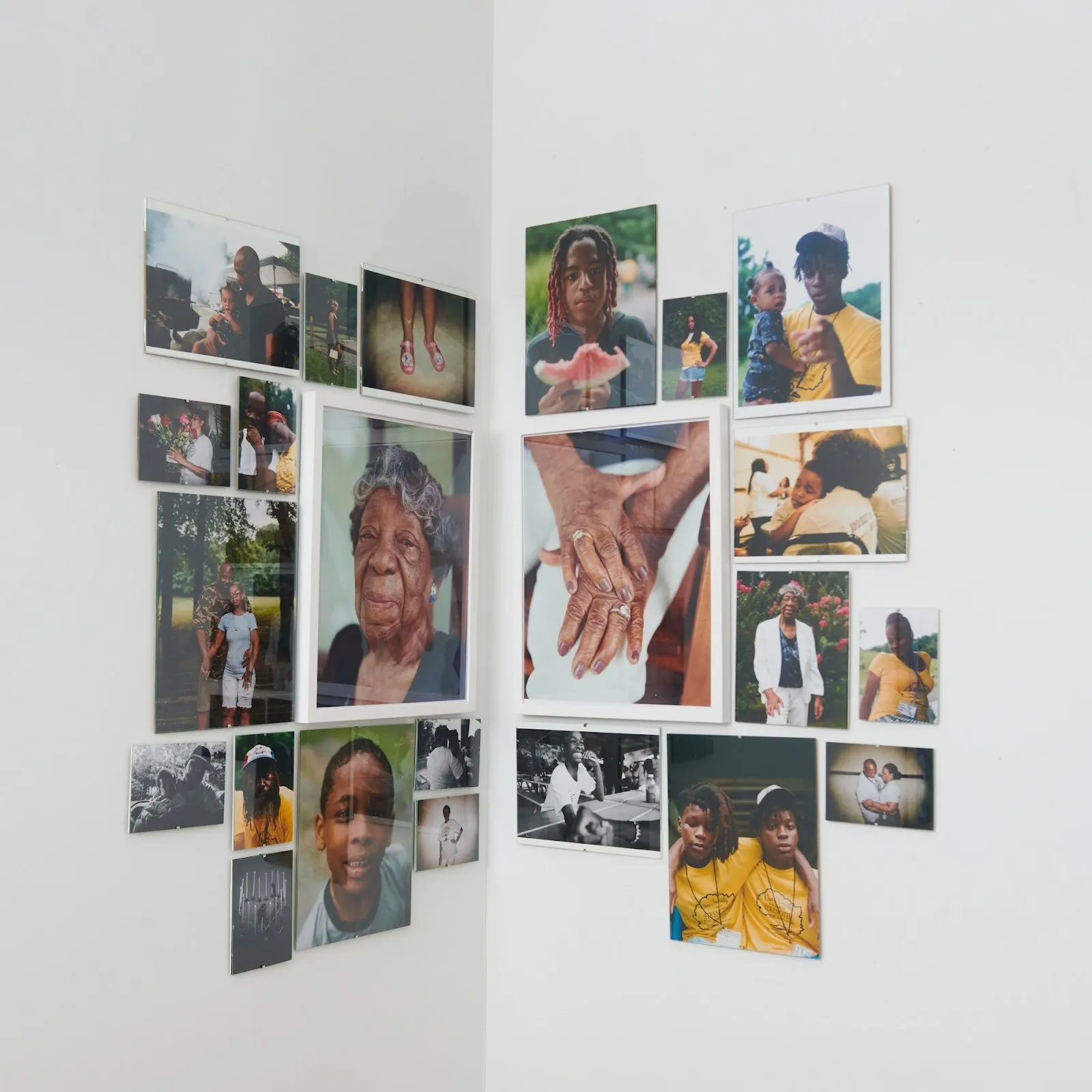 Photographics of nuvany davis's family installed on white gallery wall, boyd, digital c type prints, 25 allen street group exhibition new york now.