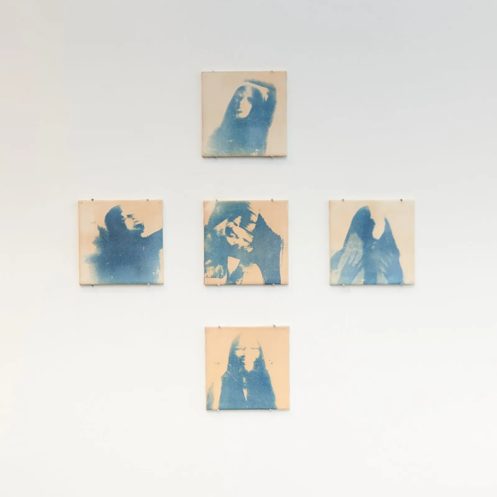 Five cyanotype on ceramic pieces in cross layout of woman laughing, Praise Fuller, Peripheral prayers for my wellbeing, group exhibition new york now 25 allen street, saam niami and gabrielle richardson, impulse magazine, sophie steinberg.