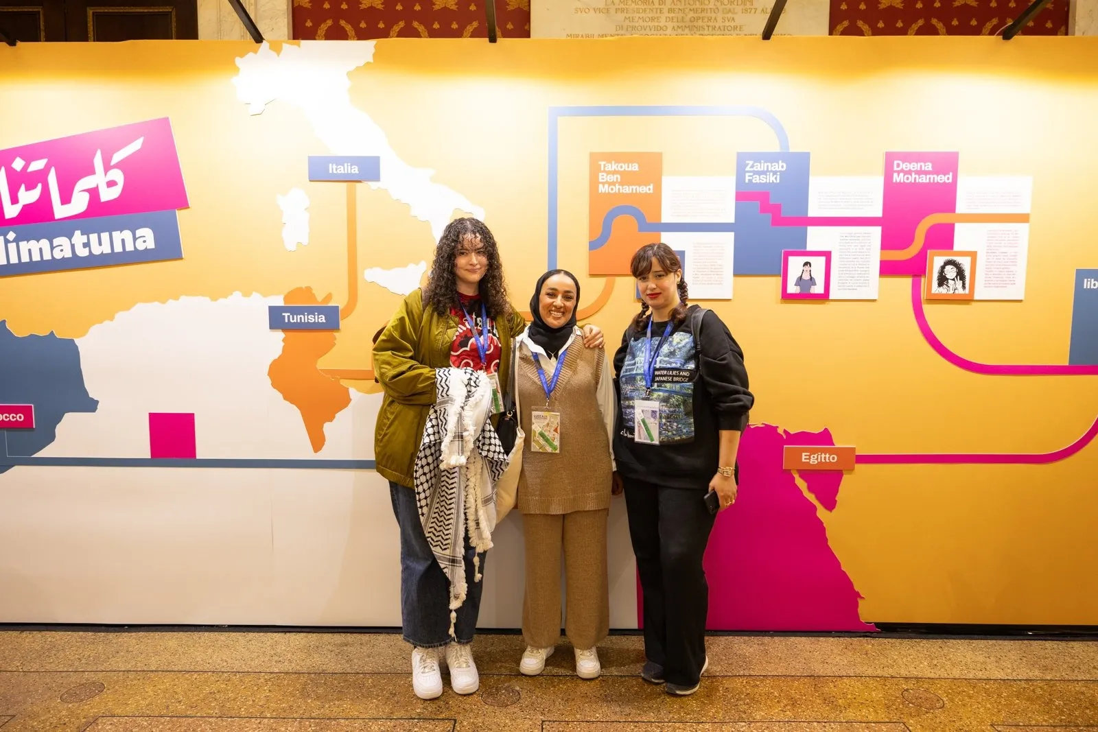 From the left, cartoonists Deena Mohamed, Takoua Ben Mohamed, and Zainab Fasiki at the opening of Kalimatuna at Palazzo Ducale, Lucca (Italy), during Lucca Comics & Games 2024, Riccardo Bonuccelli.