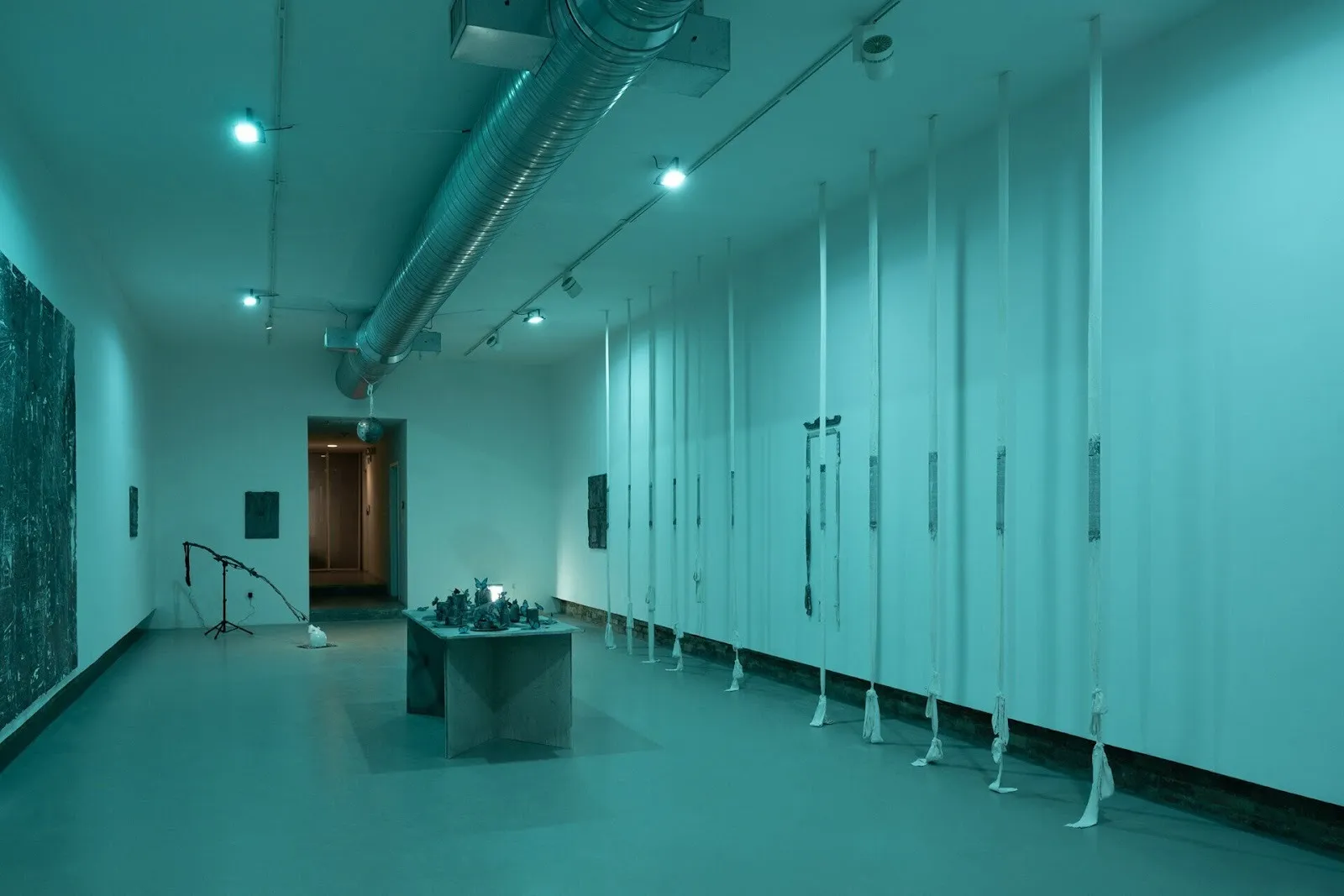 Gallery exhibition of sculptures and installations covered in blue light, Misha Ilin, pale grass blue at hamiltonian artists.