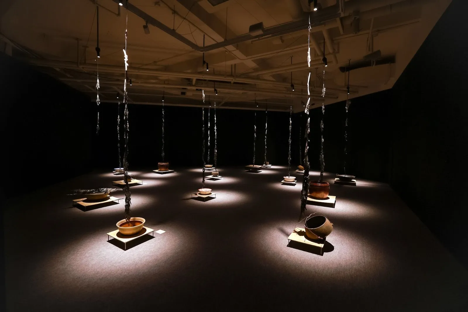 JinJin Xu, What Would You Hear If You Could? #8: Against This Earth, We Knock, nvshu installations hanging from ceiling of how art museum with spotlights, solo exhibition.