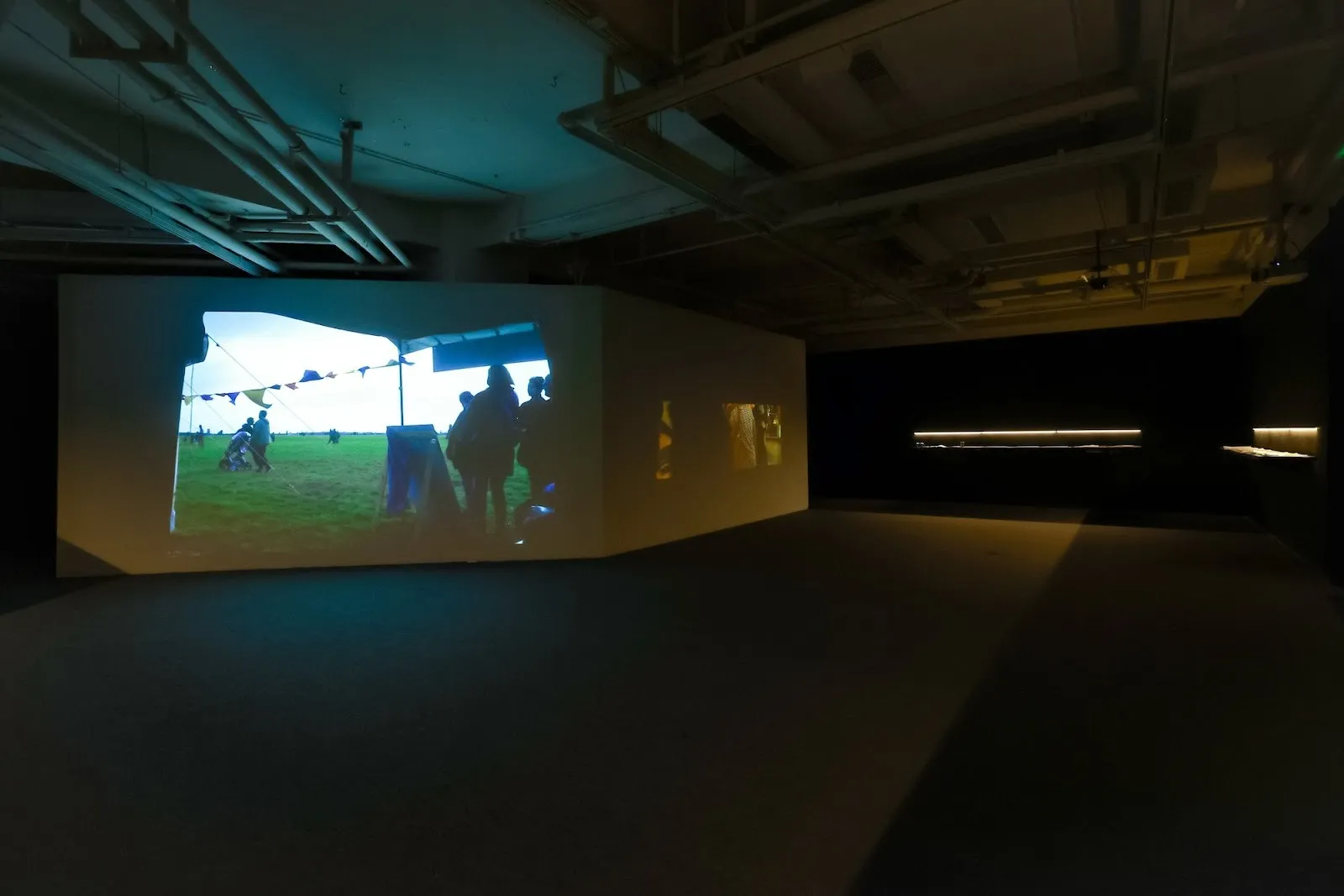 Panels of video projection of migrant women and refugees in Germany, JinJin Xu, Outside Women* Café (II), against this earth, she knocks solo exhibition at how art museum.