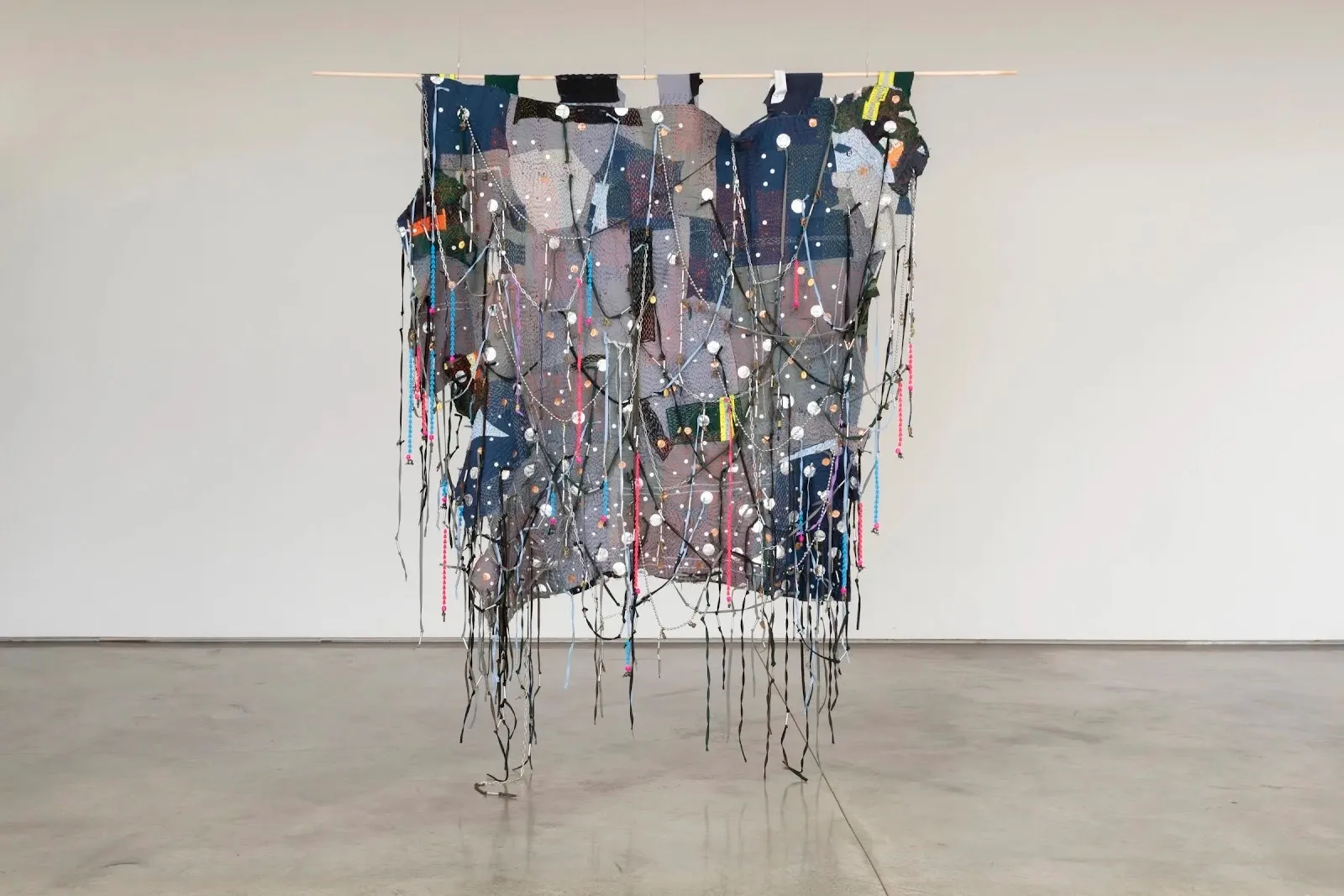 Jakkai Siributr, HC20, weaved textile fiber art hanging at flowers gallery london in thai artist's solo show, deconstructed uniforms, beads, and talismanic objects collaged into one work.