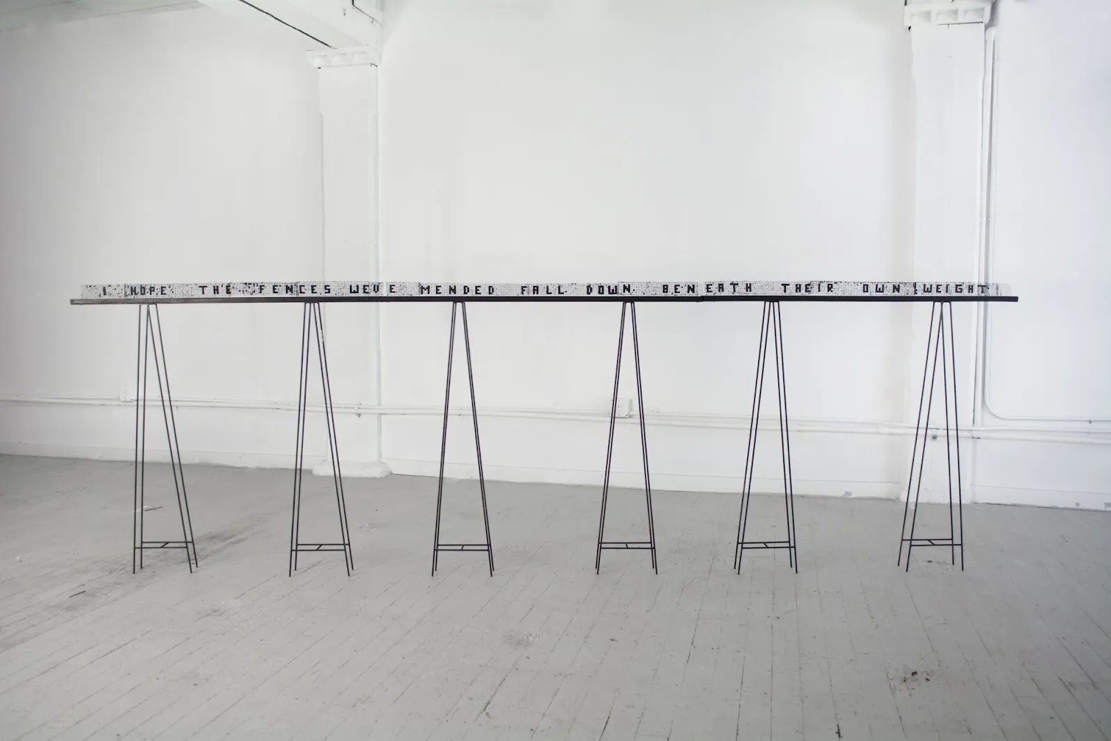 Installation view of Christina Barrera, Para Todos Todo, Free in the Open Air, MAMA Projects Gallery revolutionary festival artist social justice art. I hope the fences we've mended fall down beneath their own weight.