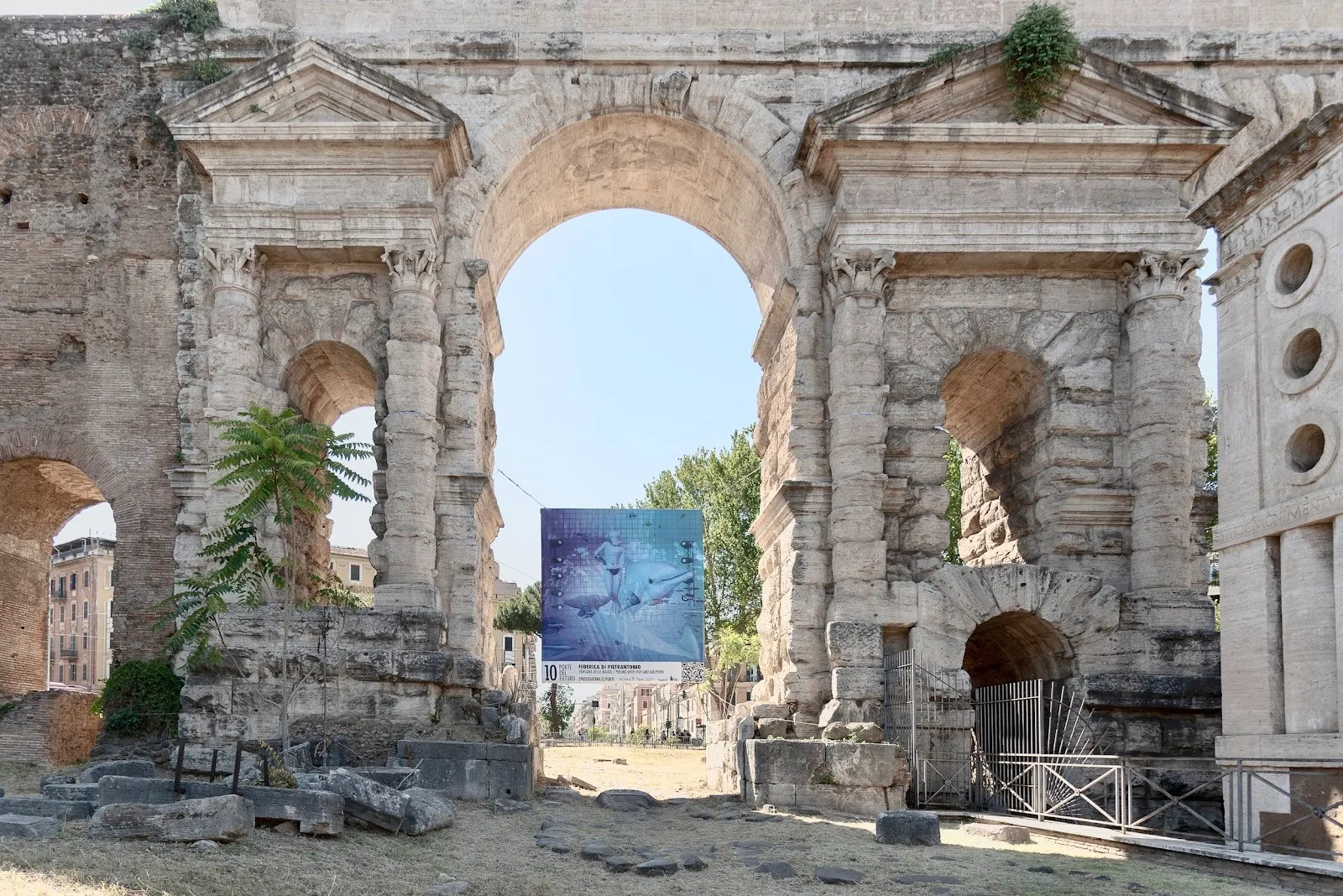 Federica Di Pietrantonio, Fontana delle Naiadi / posing with fish and dolphins, Porta Maggiore, Rome, Italy, ten gates into the future.