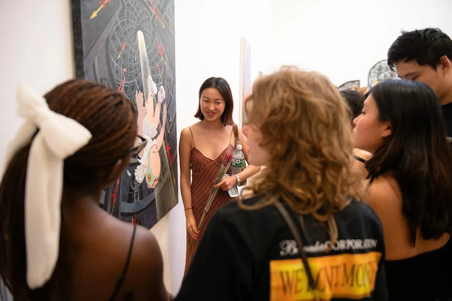 Angela Wei in front of her work at the opening of Arcus at Rachel Uffner Gallery, fashion and art journalist, artist photographer painter model, Asian diaspora, US immigration and Canada, Chinese