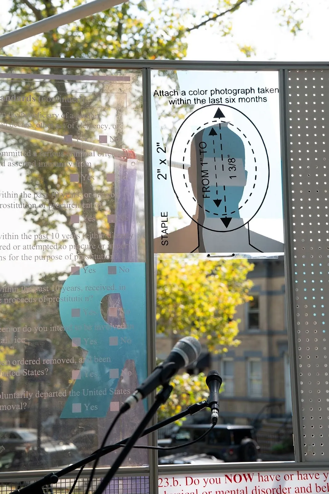 Facial recognition graph with immigration qustionnaire, Suitcases and printed mesh installation about immigration policies Xenoduo. A Mobile Home. Public installation at Sunset Park, More Art.