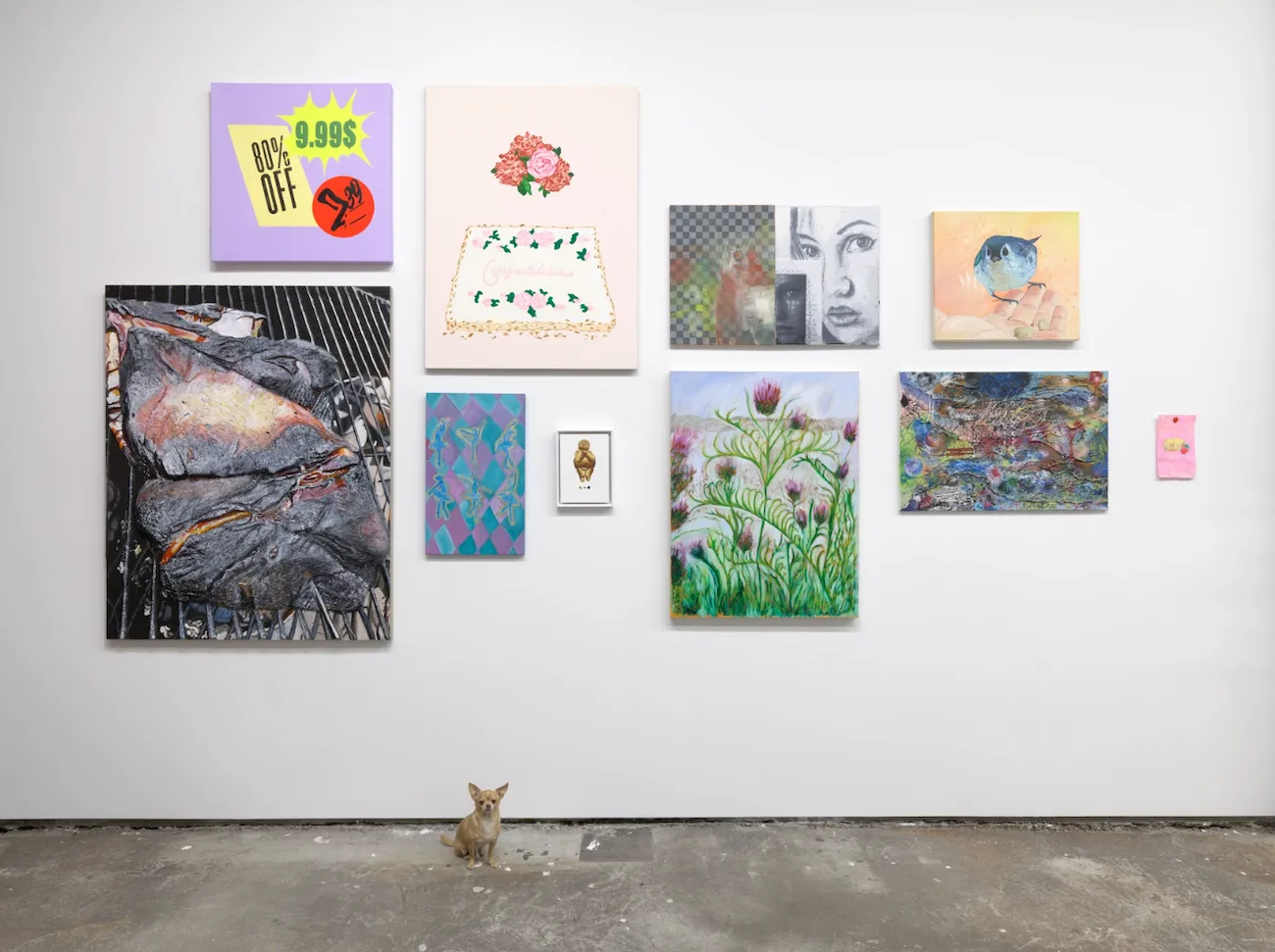 Paintings mounted on gallery wall with a chihuahua sitting in front, Artists & Recipes Marvin Gardens.