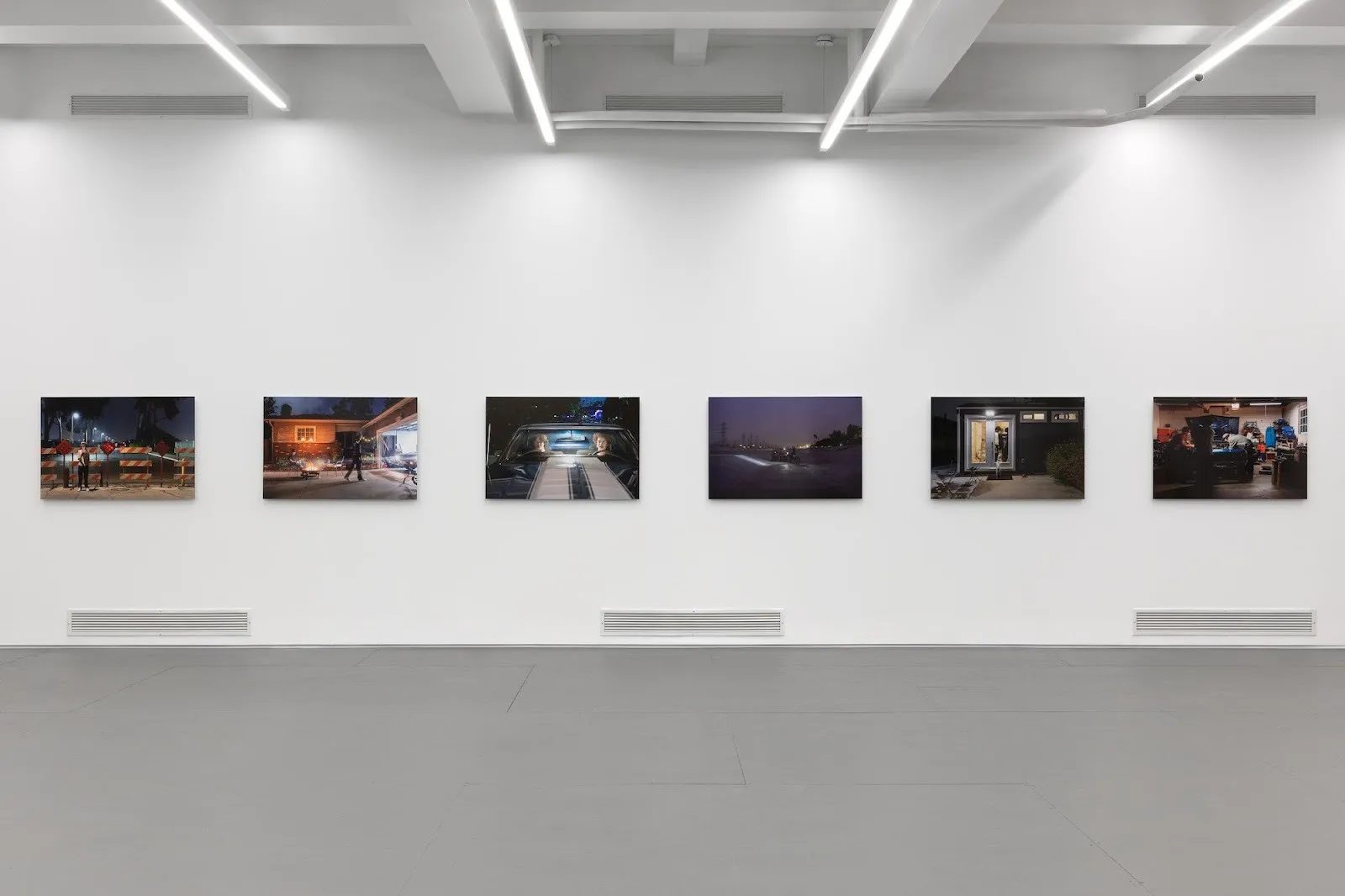 Five nighttime paintings installed in el museo del barrio, flow states reviewed by sterling corum, contemporary latinx artist group exhibition, christina fernandez suburban nightscapes.