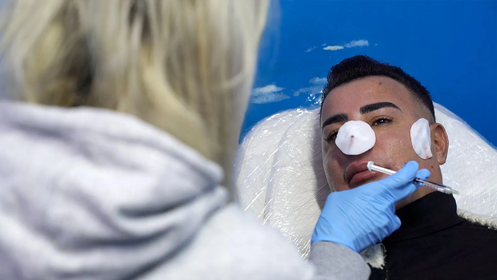 Botox customer at an aesthetician's office waiting for treatment, beirut lebanon postwar society and beauty standards, a frown gone mad, documentary by Omar Mismar, interviewed by gabriele di donfrancesco.