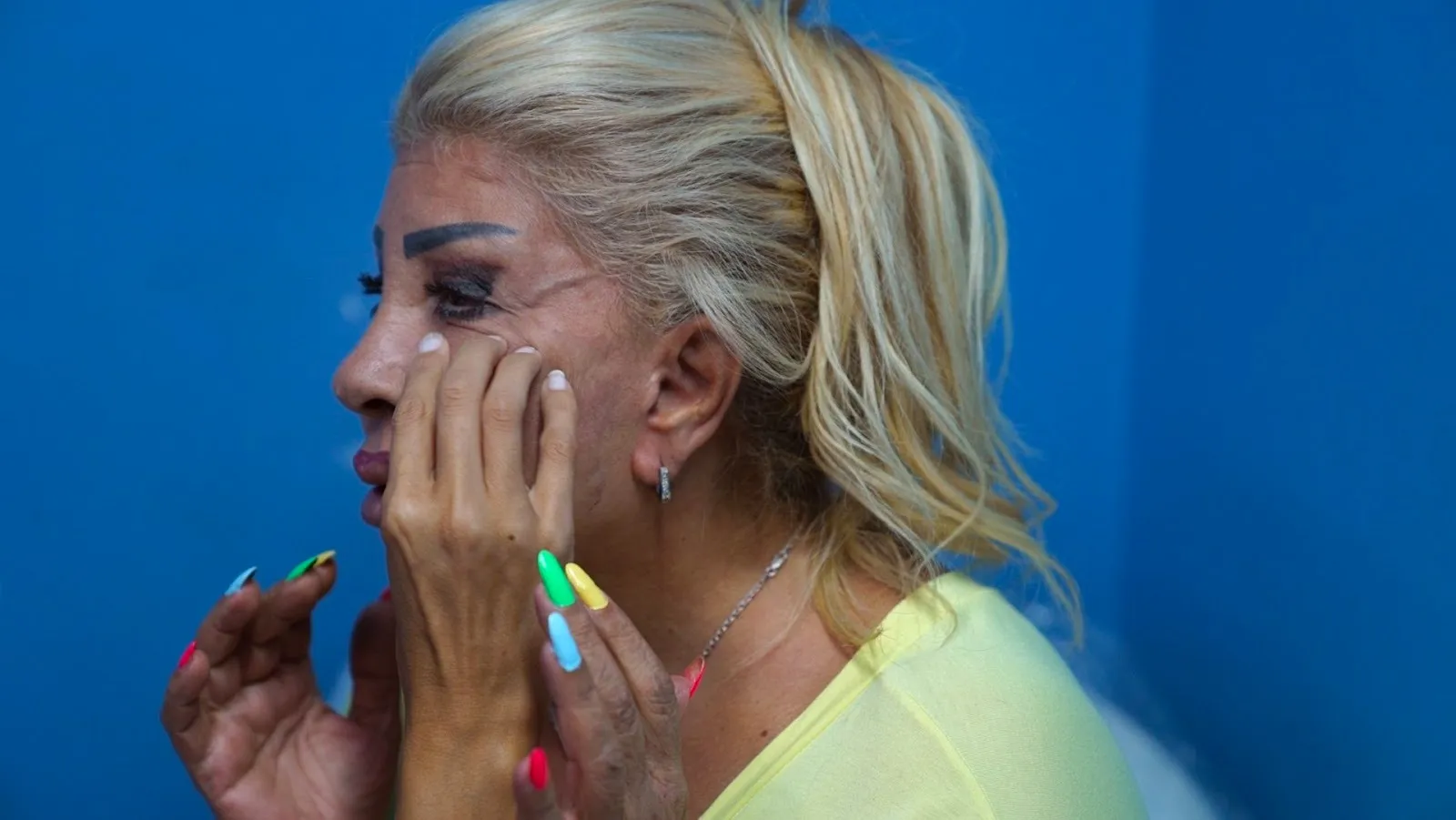 Botox customer at an aesthetician's office waiting for treatment, beirut lebanon postwar society and beauty standards, a frown gone mad, documentary by Omar Mismar, interviewed by gabriele di donfrancesco.