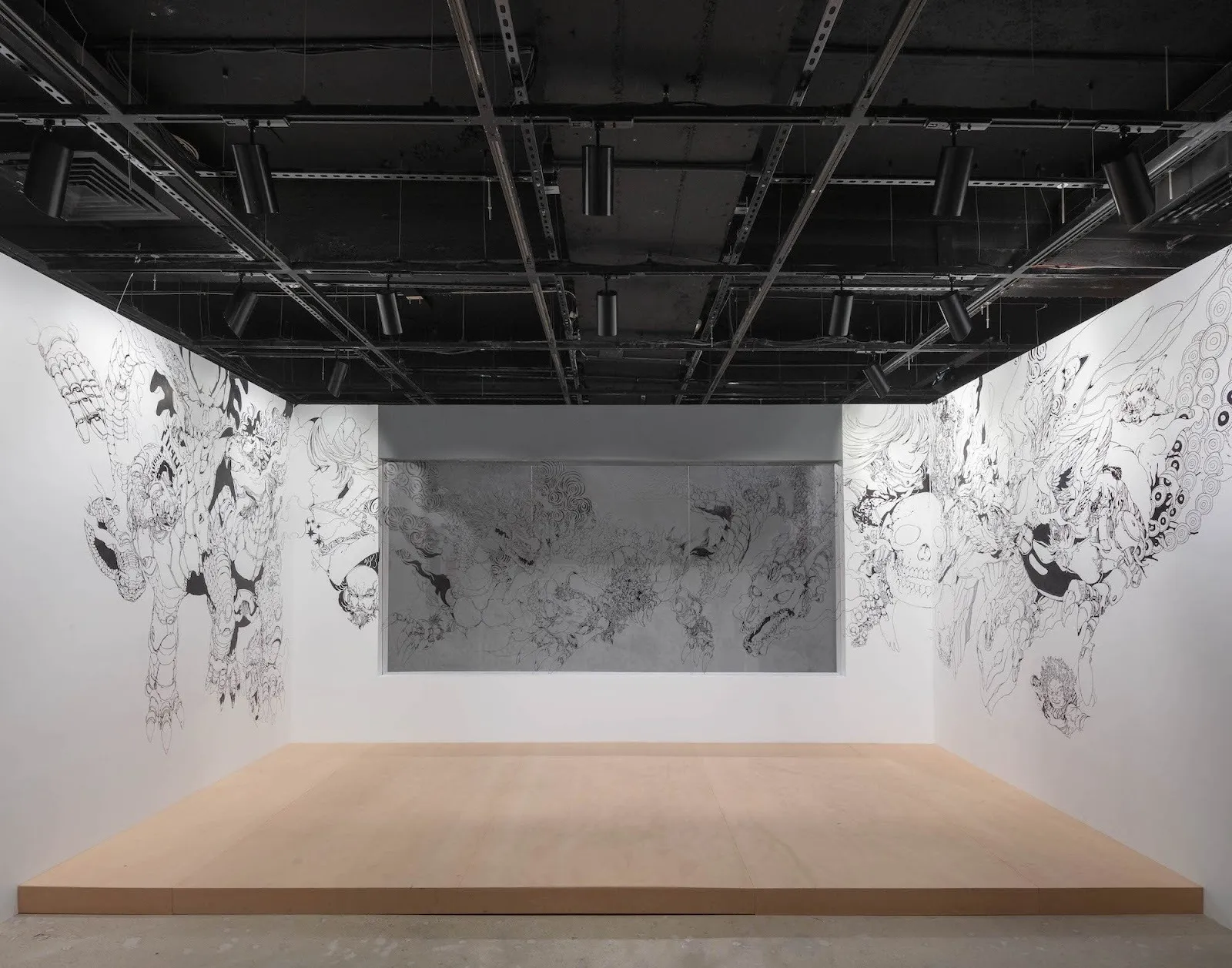 Acky Bright japanese artist solo exhibition studio infinity at japan society, installation view, reviewed by a.e. chapman, walls with anime and manga styled drawings.