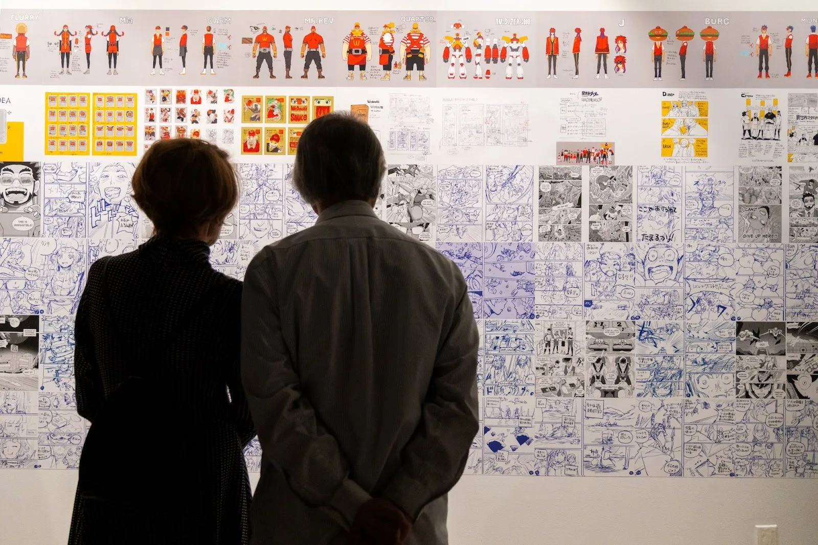 Acky Bright japanese artist solo exhibition studio infinity at japan society, installation view, reviewed by a.e. chapman, fictional crew design for mcdonald's workers taped on wall.