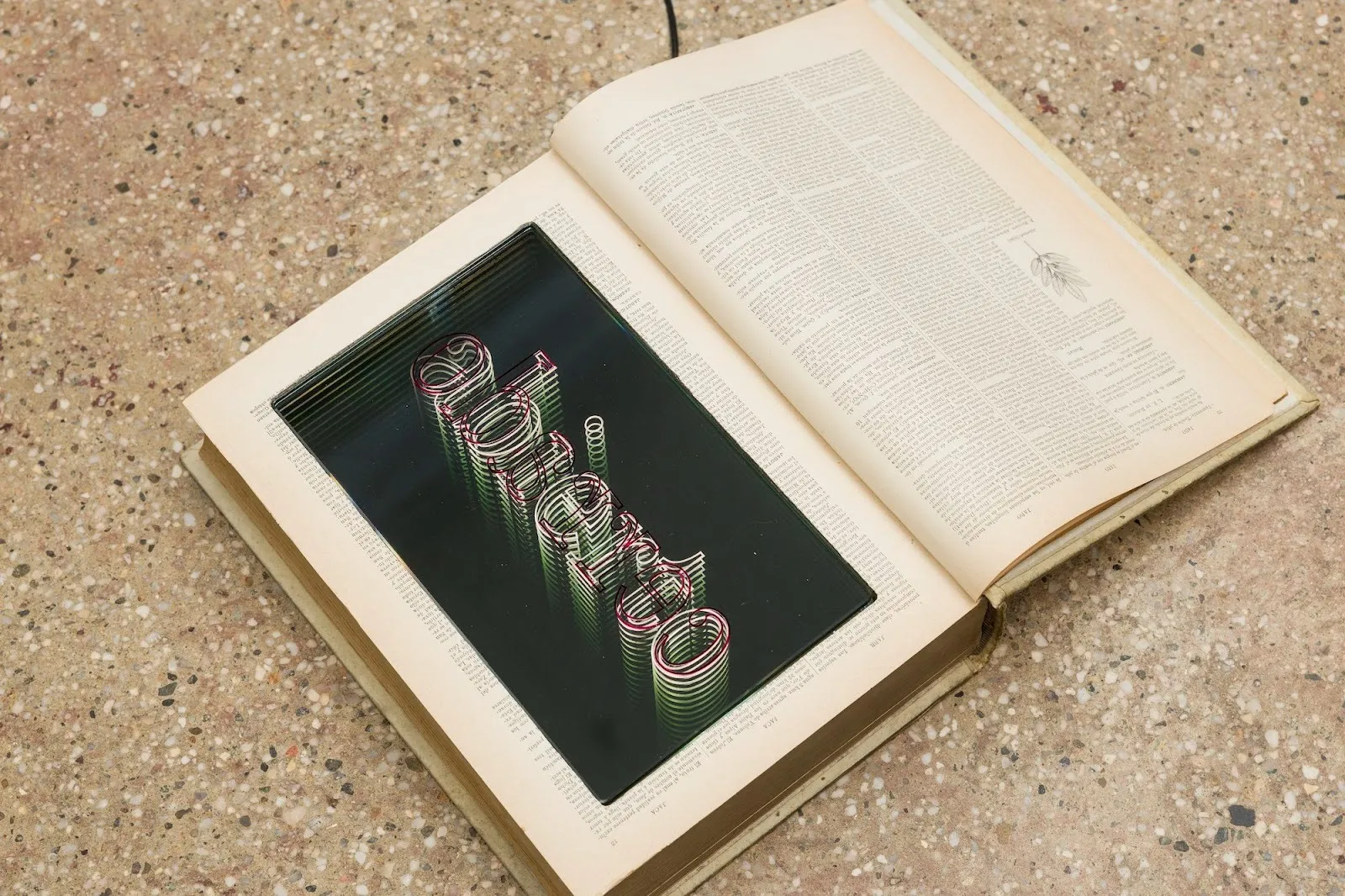 Open book, image of black background and neon sign abierto, installation view of Iván Navarro solo exhibition Small Talk at Miriam Gallery, chilean political art reviewed by emma jones, impulse magazine.